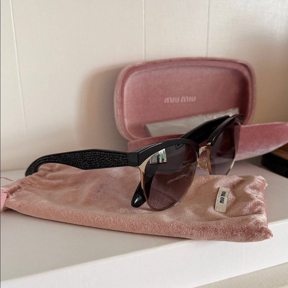 Miu Miu Black Sunglasses with Gold Accents and Brown Gradient Lenses
